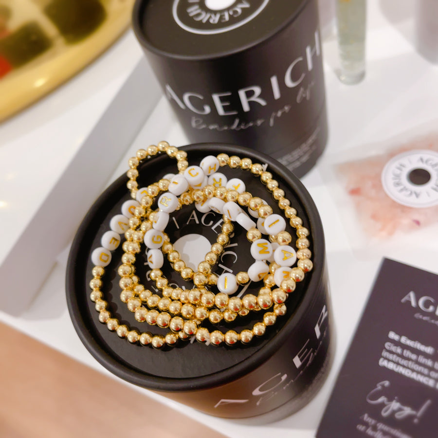 Affirmation Bracelet Set: In our 'Affirmation Bracelet Set' 14k gold plated beads, you'll have all of our 4 key affirmations including our limited AGERICH bracelet.  'I AM' 'I AM RICH' 'I AM LOVED' 'I AM FREE' 'AGERICH'
